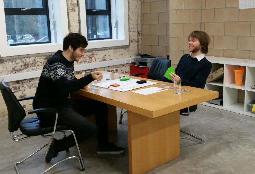 Steve and colleague playtest the prototype. Blazing rows not pictured.